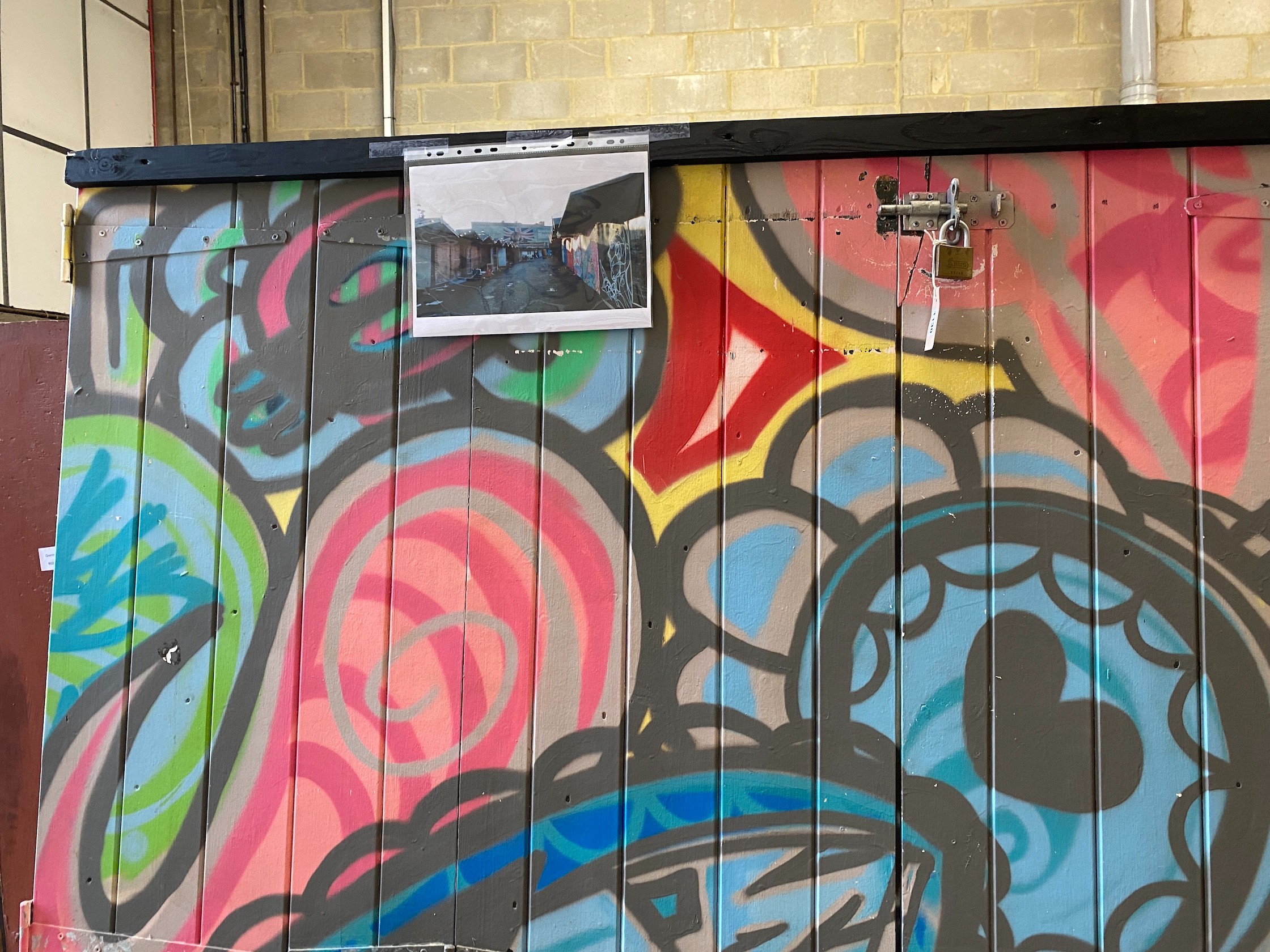 A wooden door from Camden Market with painted graffiti art width 216cm, height 207cm